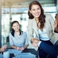 Cropped shot of two businesspeople shaking hands during a meeting in the boardroom