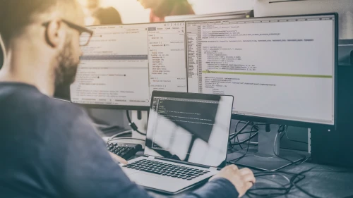 Developing programming and coding technologies. Website design. Programmer working in a software develop company office.
