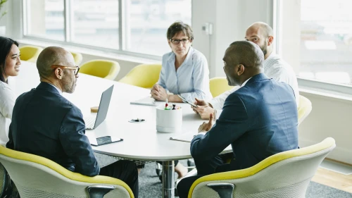 Group of businesspeople in team meeting in office conference room