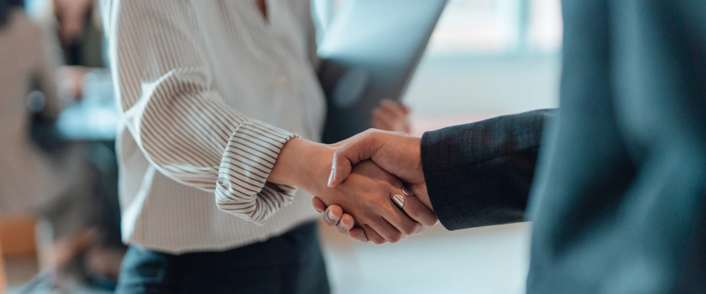 Cropped shot of business people standing in a modern office, shaking hands after having a successful meeting and reaching an agreement. Welcoming new hire. Celebrating success and achievement.
