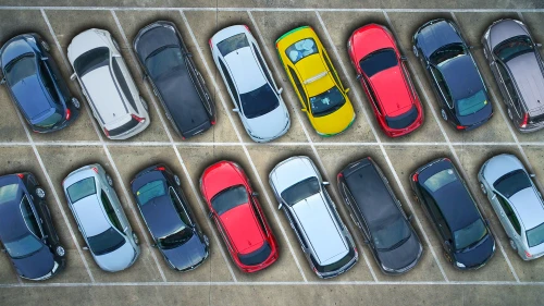 Aerial view of cars in a parking lot.