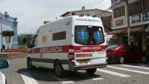 Ambulance driving past the park in Cotacachi, Ecuador