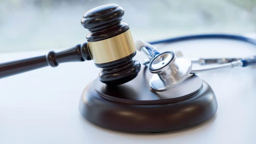 Gavel and stethoscope. medical jurisprudence. legal definition of medical malpractice. attorney. common errors doctors, nurses and hospitals make.