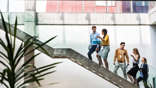 Attractive men and women after a training or a conference. Employee education concept.