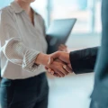 Cropped shot of business people standing in a modern office, shaking hands after having a successful meeting and reaching an agreement. Welcoming new hire. Celebrating success and achievement.